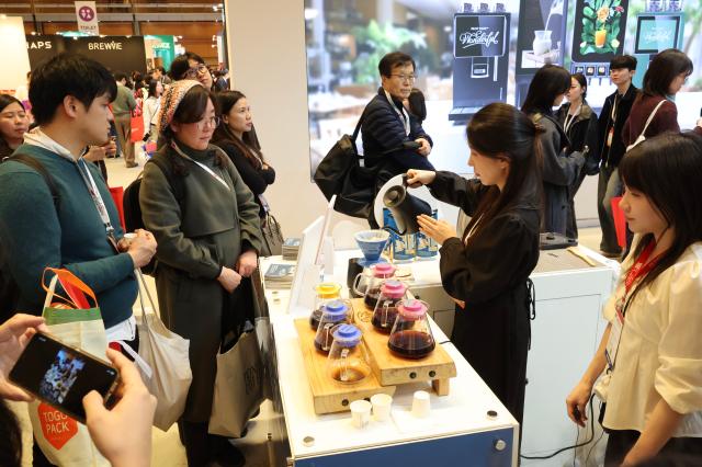 A barista brews coffee at a booth at Cafe Show 2025 held at COEX in southern Seoul Nov 20 2025 AJP Han Jun-gu