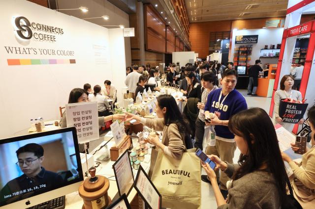People taste desserts at Cafe Show 2025 held at COEX in southern Seoul Nov 20 2025 AJP Han Jun-gu