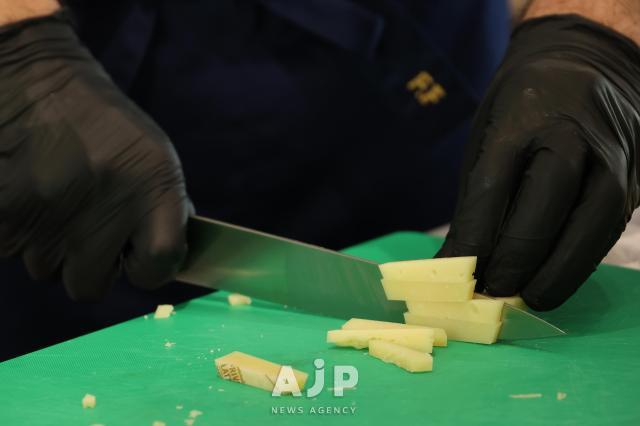 Chef Fabri slices cheese at the Italian Promotion Center in Gangnam District Seoul on Nov 14 2025 AJP Yoo Na-hyun
