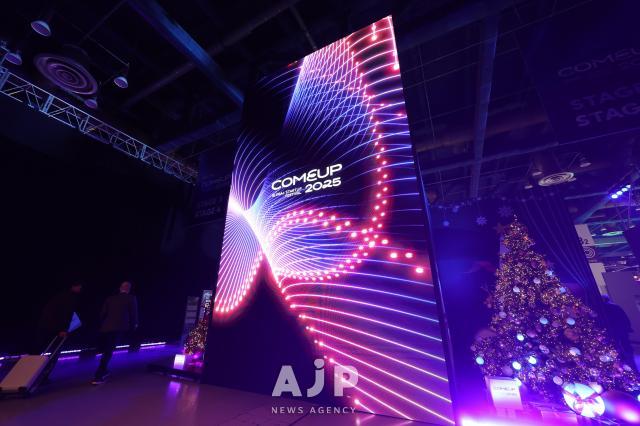 A digital mural greets visitors to the COMEUP 2025 startup festival held at COEX in southern Seoul on December 10 AJP Han Jun-gu