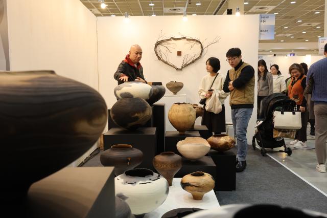 Visitors view craft items at the 2025 Craft Trend Fair held at COEX in Seoul on Dec 11 2025 AJP Han Jun-gu