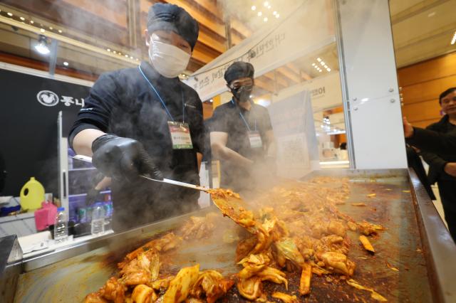 booth staff members prepare food samples at the Festive Gift Fair held at COEX in Seoul on Dec 11 2025 AJP Han Jun-gu