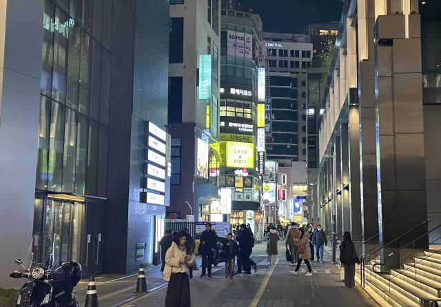 A street in Myeongdong one of Seoul’s busiest commercial districts shows lighter crowds on a winter evening on Dec 12 2025 AJP Kim Hee-su