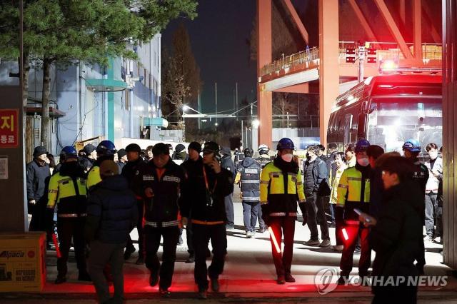 Police and fire authorities are deployed at a collapsed library construction site in the southwestern city of Gwangju on Dec 12 2025 Yonhap