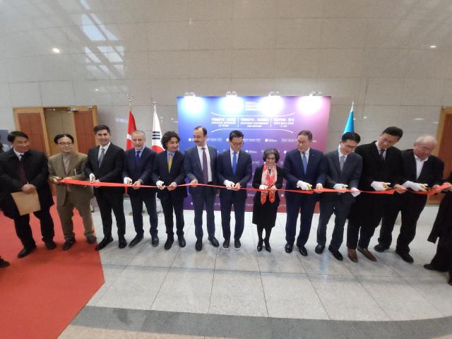 Esra Dogan Grajover center Deputy Chief of Mission at the Embassy of the Republic of Türkiye in Seoul takes part in a ribbon-cutting ceremony during the Türkiye Meetings at Korea University in Seoul on Dec 15 AJP Park Sae-jin