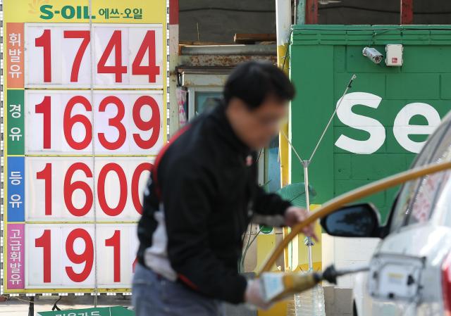 Gasoline prices are displayed at a gas station in Seoul on December 2 Yonhap