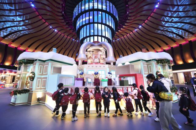 Visitors observe Christmas-themed structures at Inspire Entertainment Resort in Jung-gu Incheon on Dec 16 2025 AJP Han Jun-gu