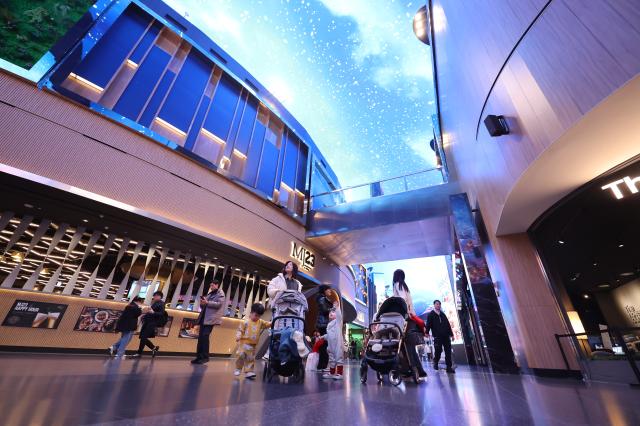 Visitors view a large Christmas-themed LED display at Inspire Entertainment Resort in Jung-gu Incheon on Dec 16 2025 AJP Han Jun-gu