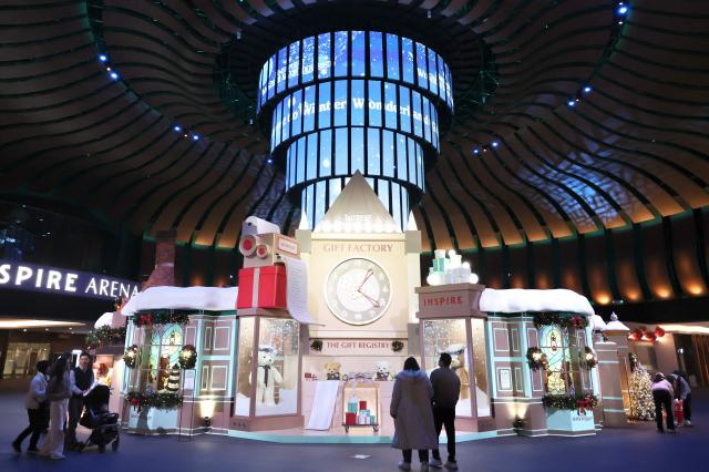 Visitors observe Christmas-themed structures at Inspire Entertainment Resort in Jung-gu Incheon on Dec 16 2025 AJP Han Jun-gu