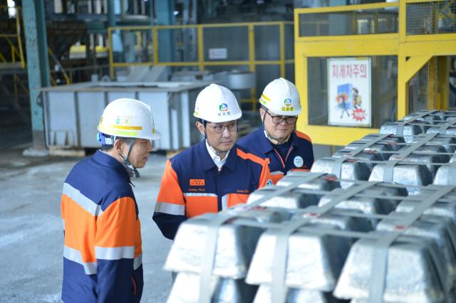 Korea Zinc chairman Choi Yoon-birm inspects antimony ingots produced by the firm Courtesy of Korea Zinc