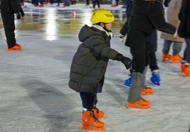 Visitors skate at the Seoul Plaza Ice Rink in Jung-gu central Seoul on Dec 19 AJP Yoo Na-hyun