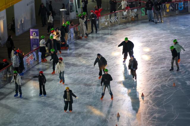 Visitors skate at the Seoul Plaza Ice Rink in Jung-gu central Seoul on Dec 19 AJP Yoo Na-hyun