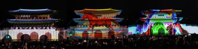 Visitors enjoy a media art show projected against the backdrop of Gwanghwamun Gate during the Seoul Winter Festa Dec 12 2025 AJP Yoo Na-hyun