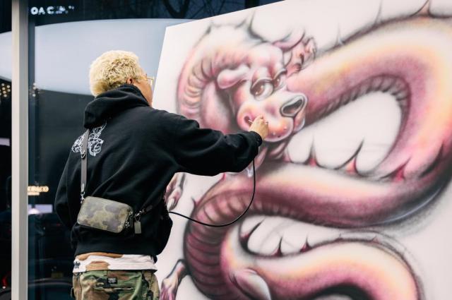 Japanese contemporary artist Ryota Daimon performs live drawing at Lotus Cars Koreas flagship showroom in Gangnam Seoul Courtesy of Lotus Cars Korea