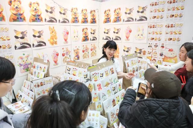 Visitors browse booths at an illustration fair held at COEX in Gangnam Seoul on Dec 26 2025 AJP Han Jun-gu