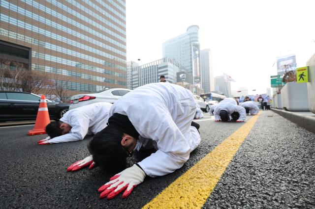 Protesters perform samboilbae three steps and one bow during a demonstration at Gwanghwamun Square in Seoul on Dec 29 2025 AJP Han Jun-gu