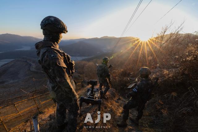 The sun rises over a forward ridgeline facing North Korea near the inter-Korean border AJP Yoo Na-hyun