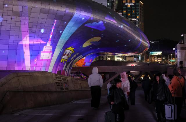 Media art illuminates the exterior of the Dongdaemun Design Plaza DDP in central Seoul during “Seoul Light DDP 2025 Winter” on Dec 30 AJP Yoo Na-hyun