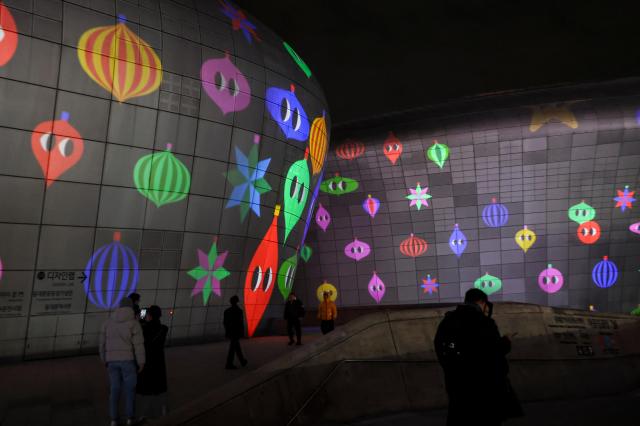 Media art illuminates the exterior of the Dongdaemun Design Plaza DDP in central Seoul during “Seoul Light DDP 2025 Winter” on Dec 30 AJP Yoo Na-hyun
