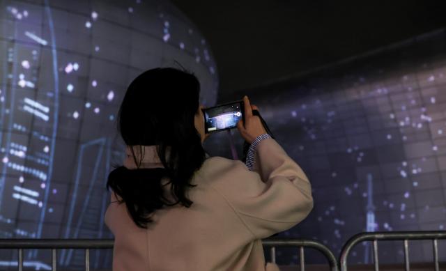 Media art illuminates the exterior of the Dongdaemun Design Plaza DDP in central Seoul during “Seoul Light DDP 2025 Winter” on Dec 30 AJP Yoo Na-hyun