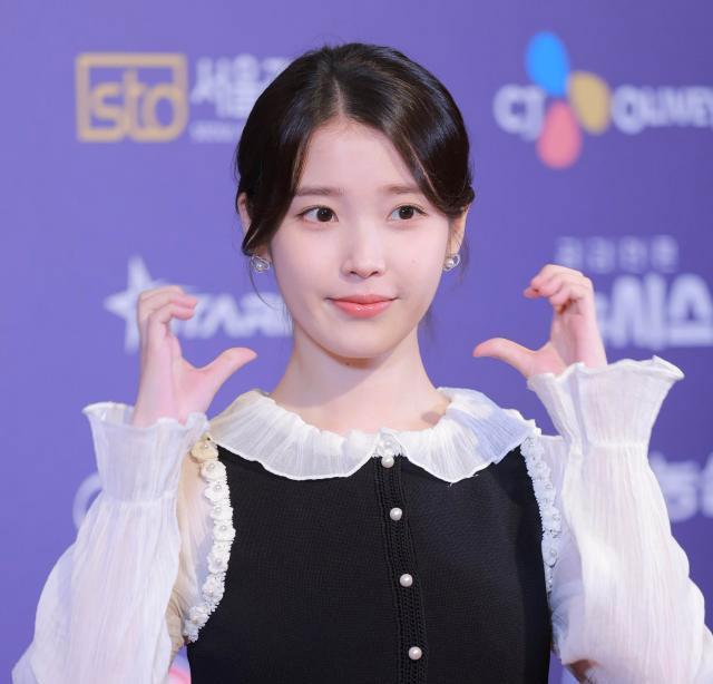 IU donates 200 million won to charities