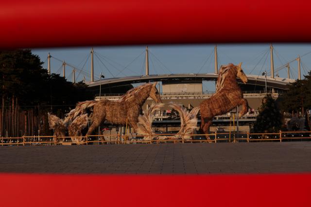 To mark the Year of the Fire Horse in 2026 two horse-shaped sculptures crafted from silver grass stand at World Cup Park in Mapo District western Seoul AJP Yoo Na-hyun

