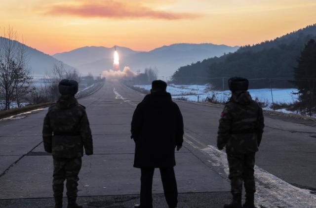 North Korean leader Kim Jong-un center observes a missile launch at a site near Pyongyang on Jan 4 2026 in this photo released by the Norths state run North Korean Central News Agency the following day