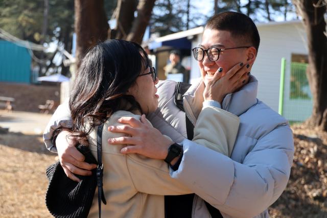 A mother and son share an emotional embrace before the first military enlistment ceremony of 2026 at the Army Training Center in Nonsan South Chungcheong Province Jan 5 2026 Yonhap