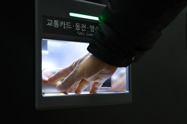 A citizen collects a single-journey transportation card at Jonggak Station in Jongno-gu Seoul Jan 7 2026 AJP Han Jun-gu