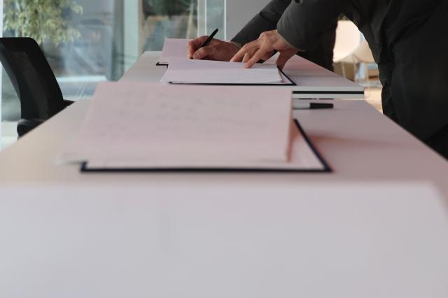 A citizen signs the guestbook at the memorial space for the late actor Ahn Sung-ki at the Seoul Cinema Center in Jung-gu Seoul Jan 7 2026 AJP Han Jun-gu