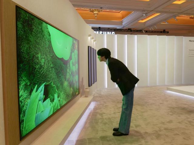 Actor Ahn Hyo-seop takes a look at Samsung Electronics’ new AI TV at the company’s standalone “The First Look” exhibition hall at CES 2026 Courtesy of Samsung Electronics