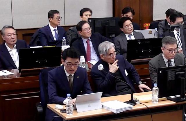 Former president Yoon Suk Yeol and 7 others accused of insurrection with their respective lawyers at what should have been the final hearing at the Seoul Central District Court in the capital on Jan 9 2026 which has been rescheduled for Jan 13 after a pause at midnight Yonhap