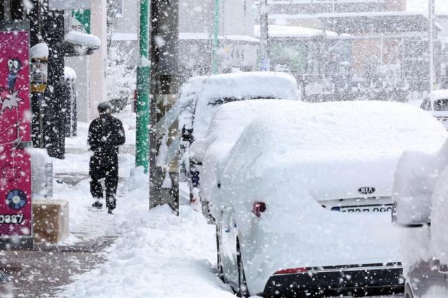 Lingering cold brings snow and rain across country