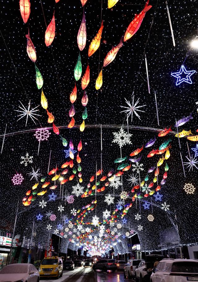 Mountain trout-shaped Korean paper lanterns and LED installations illuminate Seondeung Street in Hwacheon Gangwon Province Jan 12 2026 AJP Han Jun-gu