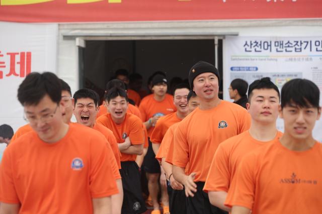 Participants enter the bare-hand fishing arena at the Hwacheon Sancheoneo Ice Festival in Hwacheon Gangwon Province Jan 12 2026 AJP Han Jun-gu
