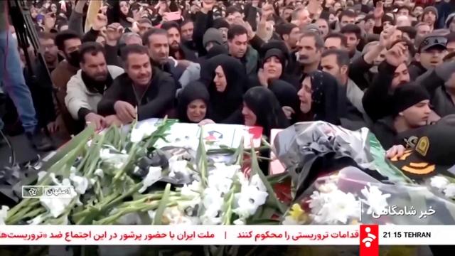 Mourners react next to coffins during a funeral procession for members of security forces and civilians said to be killed in protests on Sunday amid evolving anti-government unrest in Tehran Iran in this screengrab from a video released on Jan 11 2026 AP-Yonhap