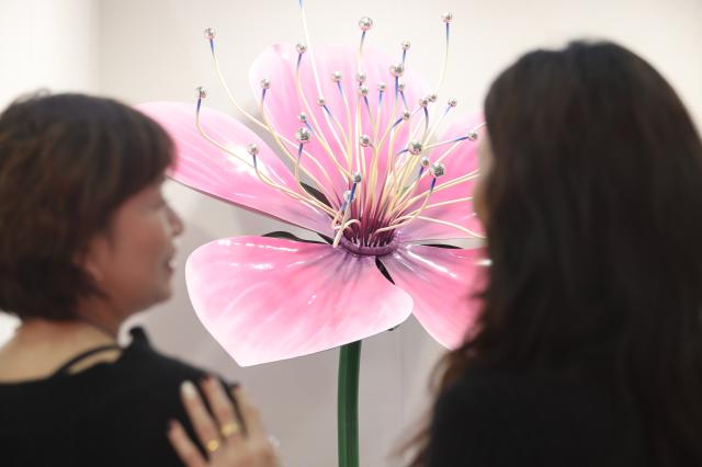 Visitors view artworks at the Seoul International Sculpture Festa 2026 at COEX in Gangnam Seoul Jan 14 2026