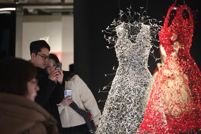 Visitors take photos of artworks at the Seoul Museum of Craft Art in Jongno Seoul Jan 20 2026 AJP Han Jun-gu