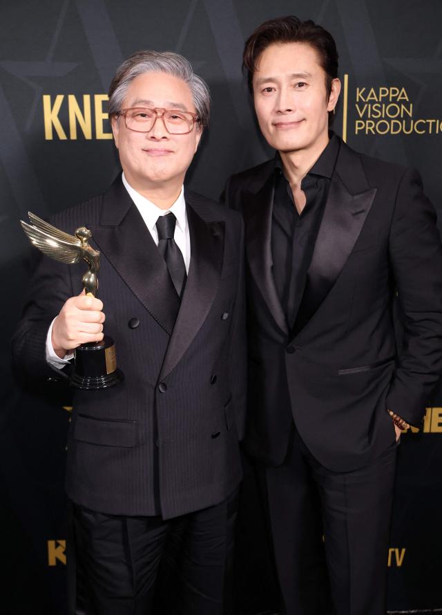 Park Chan-wook winner of the Filmmaking Achievement Award and Lee Byung-hun pose in the press room during the 2026 Astra Film Awards presented by The Hollywood Creative Alliance at Sofitel Los Angeles At Beverly Hills on Jan 09 2026 in Los Angeles California AFP-Yonhap