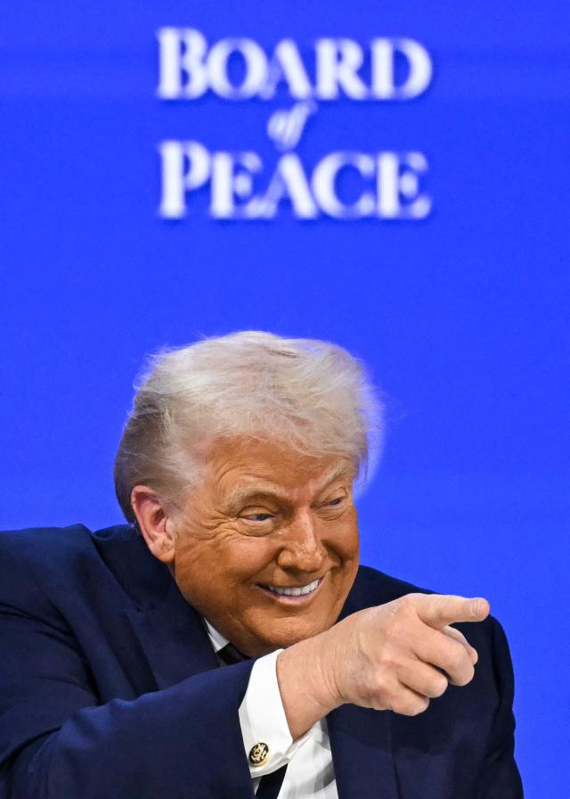 US President Donald Trump gestures as he speaks at the Board of Peace meeting during the World Economic Forum WEF annual meeting in Davos on Jan 22 2026 AFP-Yonhap