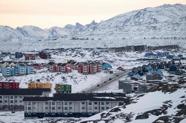 A general view shows residential buildings and a main road in Nuuk Greenland during early morning hours on Jan 22 2026 AFP-Yonhap