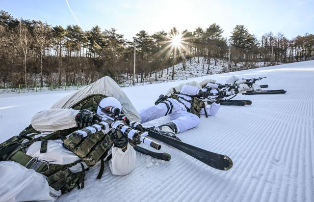 ROK Army Special Warfare Command soldiers take firing positions after encountering the enemy during tactical ski training in Daegwallyeong Gangwon Province on Jan 22 2026