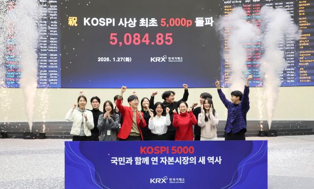 Officials from the Korea Exchange KRX hold a ceremony to celebrate the KOSPI index closing above the 5000-point milestone for the first time on Jan 27 AJP Yoo Na-hyun