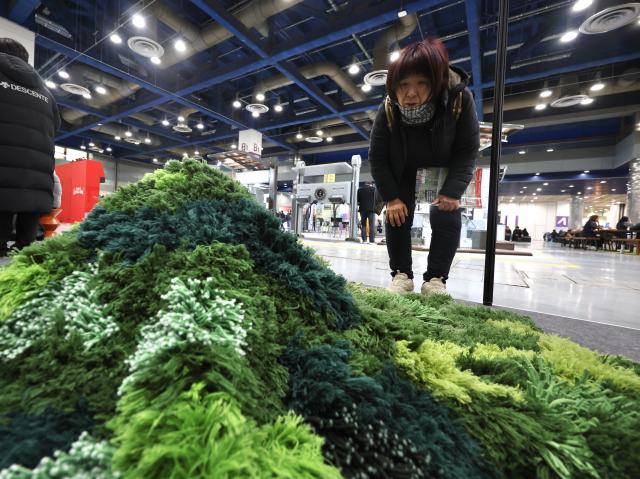 A visitor views a landscape work at Korea landscape  garden expo 2026 at COEX in Gangnam Seoul Jan 30 2026 AJP Han Jun-gu