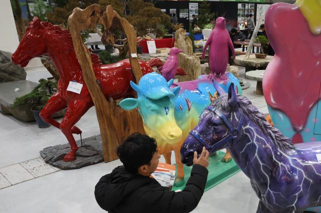 A visitor views a landscape work at Korea landscape  garden expo 2026 at COEX in Gangnam Seoul Jan 30 2026 AJP Han Jun-gu