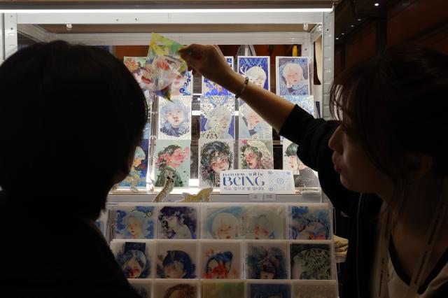 Visitors view booths at K-illustration Fair Seoul 2026 at COEX in Gangnam Seoul Jan 30 2026 AJP Han Jun-gu
