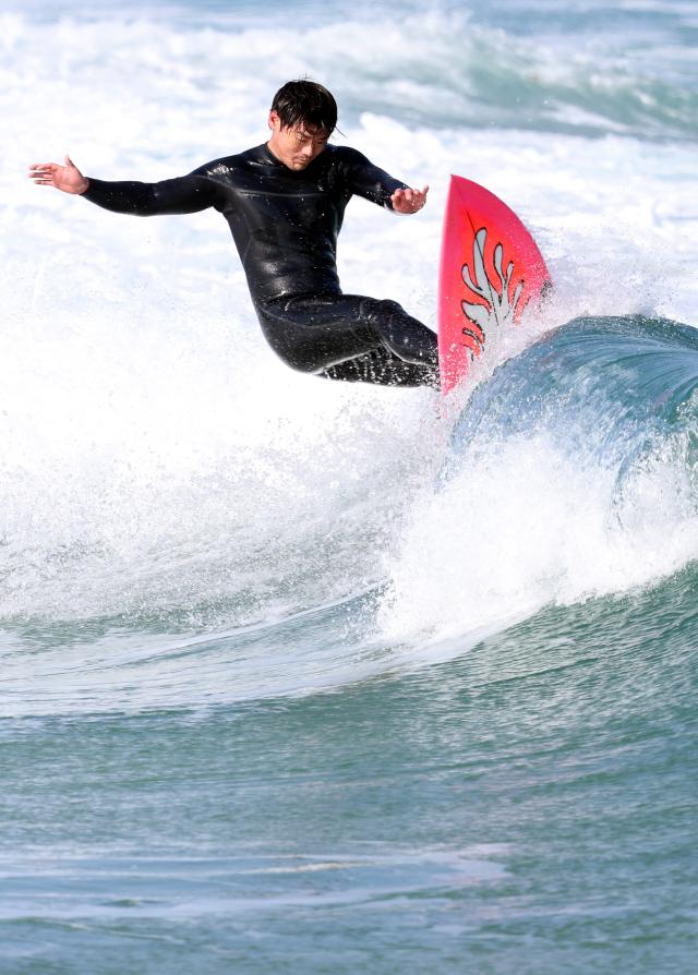 A surfer enjoys the winter sea at Yonghan-ri Beach in Heunghae-eup Buk-gu Pohang North Gyeongsang Province on Feb 1 2026 Yonhap
