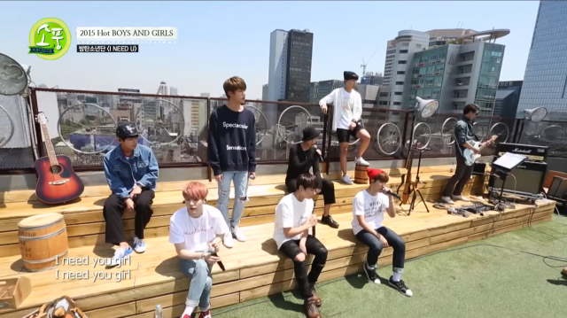 This photo captured from Picnic Live show members of BTS performing I Need U Photo captured from Official youtube channel of Picnic Live