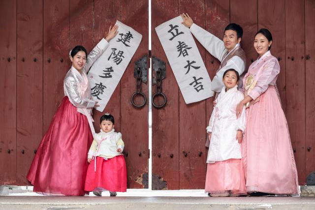 A demonstration event for posting Ipchuncheop is underway at Namsangol Hanok Village in Seoul marking Ipchun the beginning of spring in the traditional calendar on Feb 4 2026 AJP Yoo Na-hyun