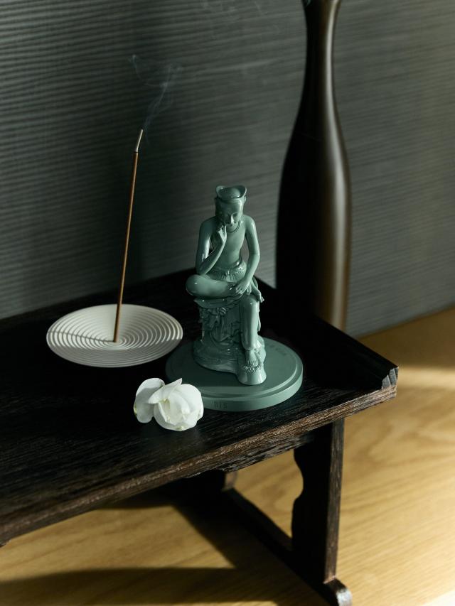 A promotional image from HYBE’s collaboration with the National Museum Foundation of Korea, ‘2024 Dalmageun BTS X MU:DS’ — a miniature of the pensive bodhisattva.